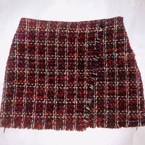 Purple, pink, and black kilt mini skirt.